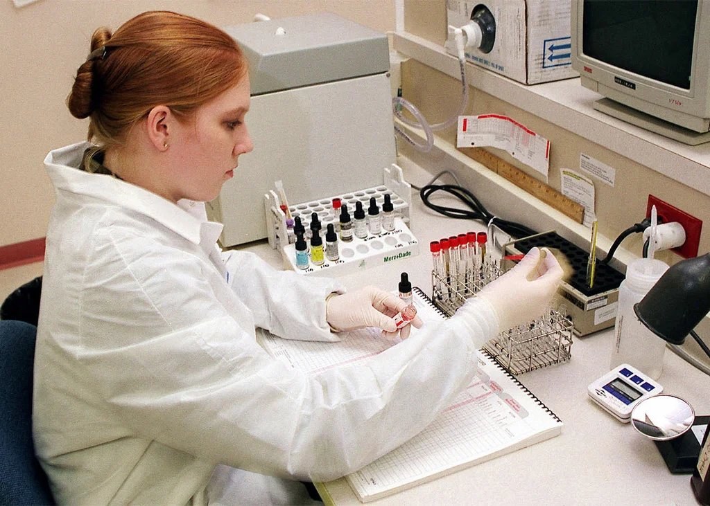 Laboratory worker arranging blood samples for medical research