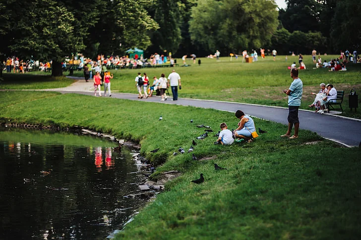 People walking in a city park as part of an active lifestyle.